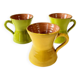 3 large green and yellow enameled ceramic cups, signed