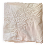 White tablecloth in fine embroidered white cotton.