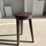 Small high tripod stool in brown solid wood