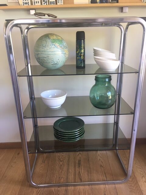 Chrome shelves and smoked glasses design