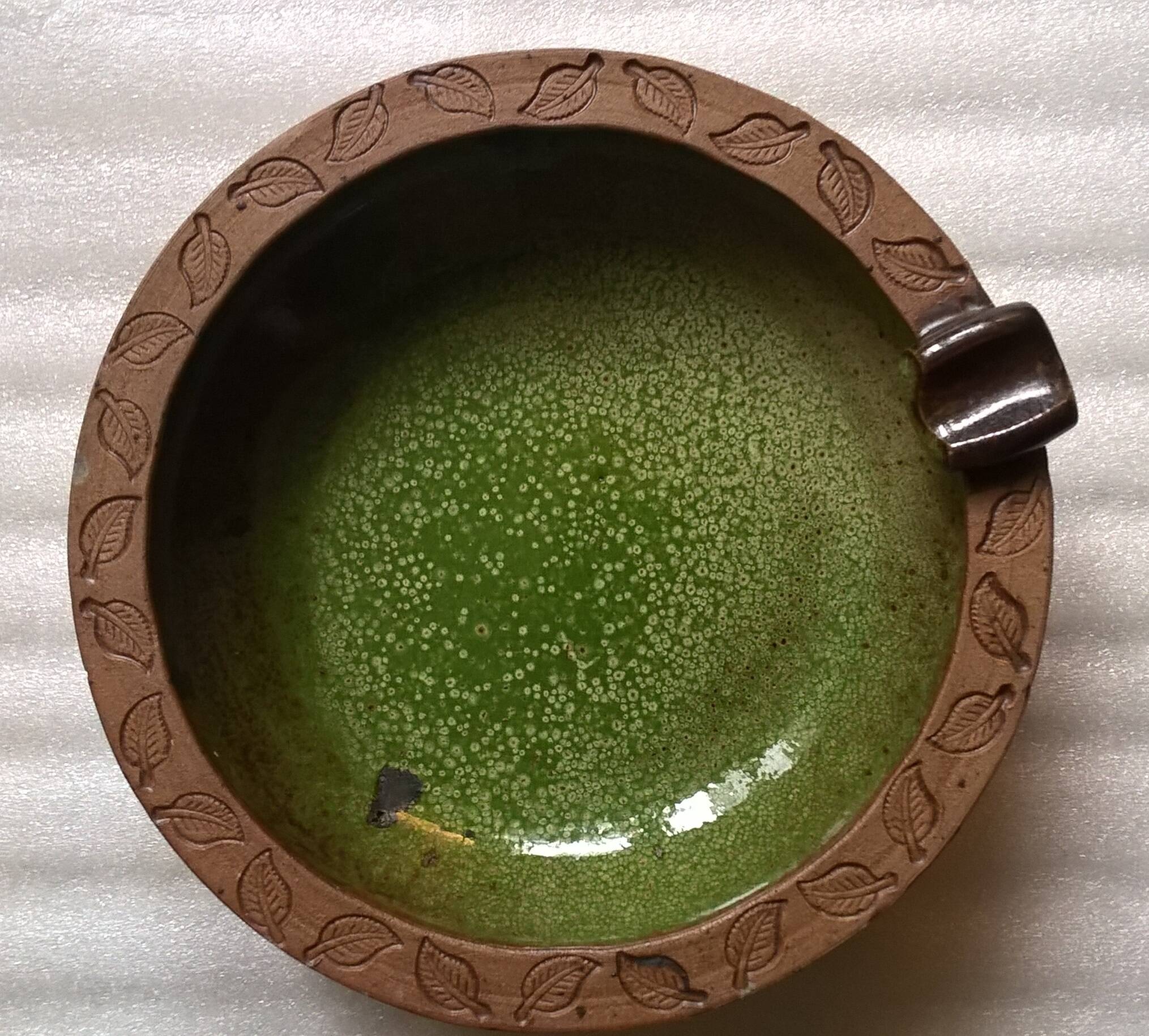 Vintage green enameled ceramic ashtray signed.