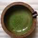 Vintage green enameled ceramic ashtray signed.