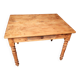 Small farmhouse table in light wood and tiled floors