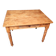 Small farmhouse table in light wood and tiled floors