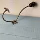 Antique coat rack with red wooden ball