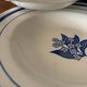 Set of 6 vintage deep plates in earthenware with blue lily of the valley flowers.