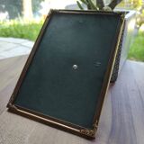 Vintage photo frame in gold and decorated metal