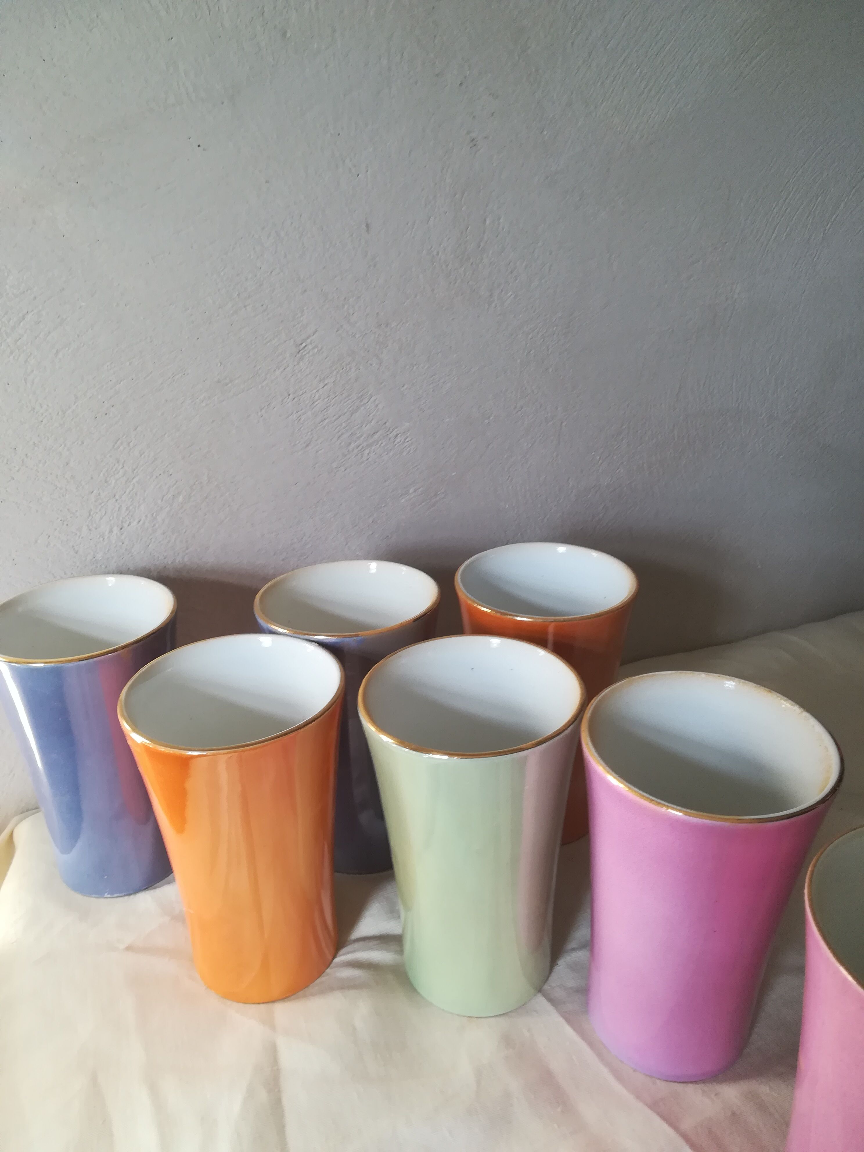 8 coloured cups in earthenware