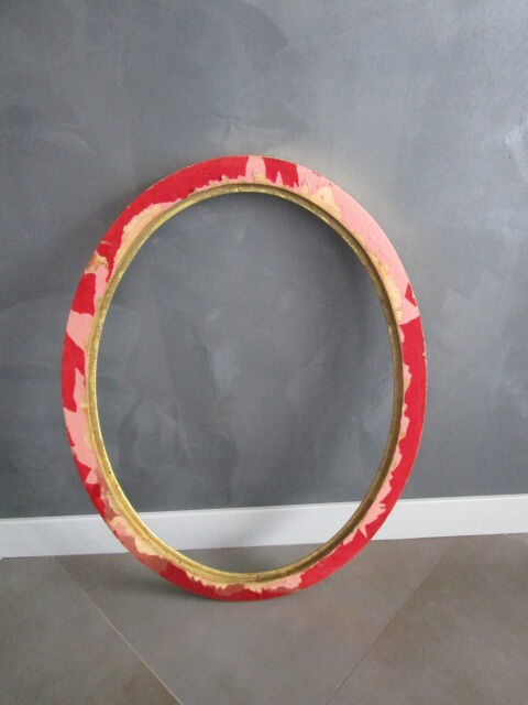 Old oval frame in gilded wood