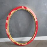 Old oval frame in gilded wood