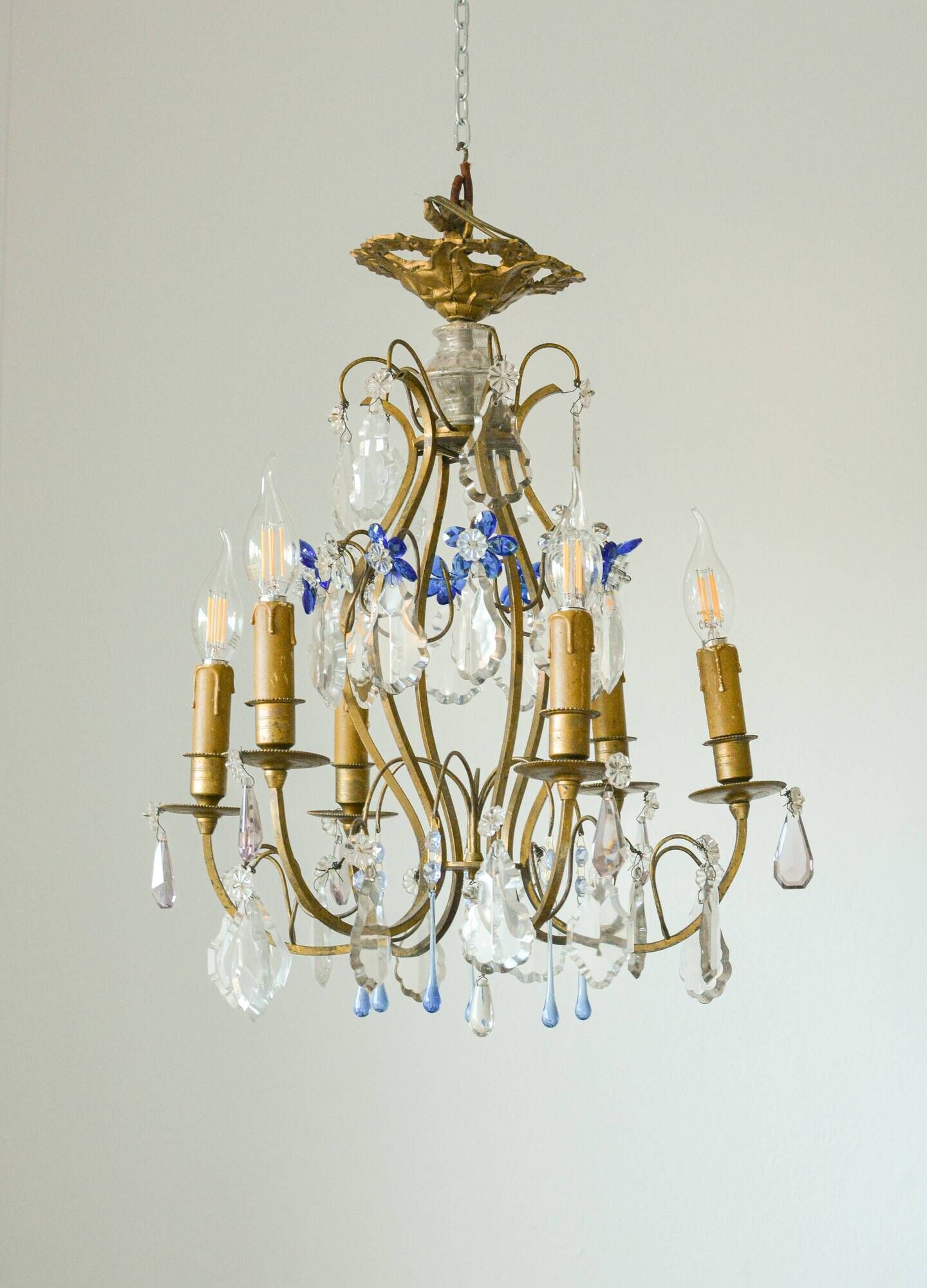 Antique French chandelier cage in gilded bronze and crystal, with blue pendants.