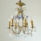 Antique French chandelier cage in gilded bronze and crystal, with blue pendants.