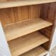 Antique Parisian wardrobe in white wood with shelves from the 1950s.