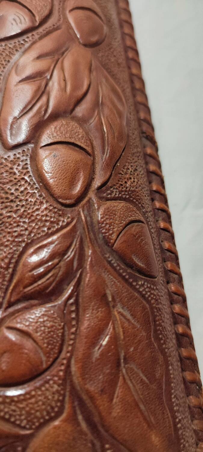 Espejo de pared de cuero. España, 1970s.