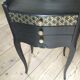 Bedside or nightstand painted black with patterns