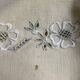 Antique embroidered linen with a floral motif