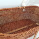Old rattan bassinet and bedding