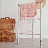 Old towel rack in patinated white wood