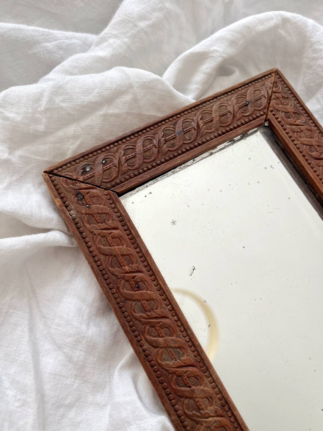 Antique mercury glass barber mirror and carved wooden frame