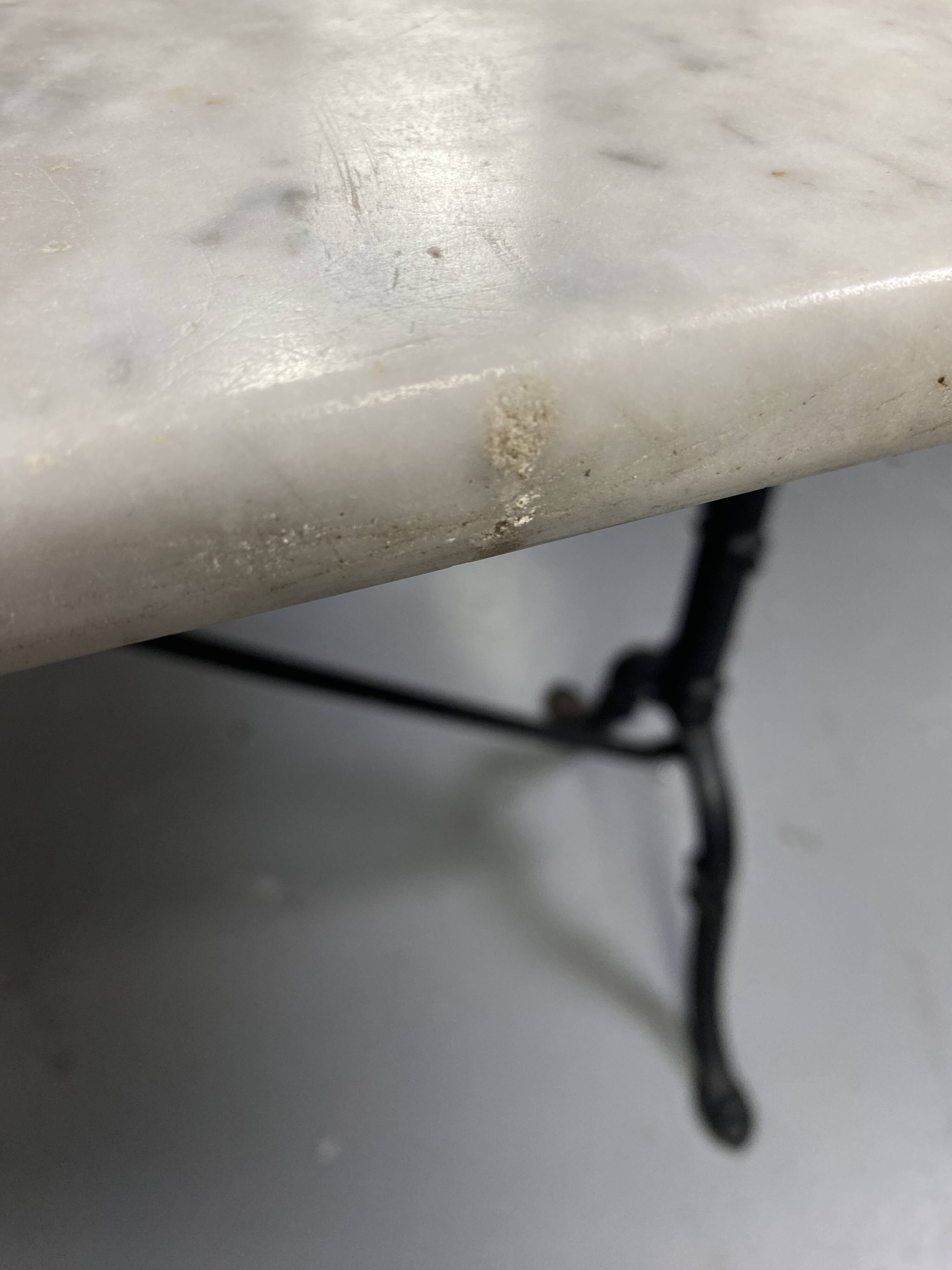 Set of two bistro tables in marble and wrought iron