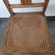 Wooden and cane chair. Carved wooden chair with cane seat.