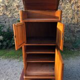 Art Deco sideboard bar cabinet in solid walnut with 3 doors and 1 richly carved tilting false drawer.