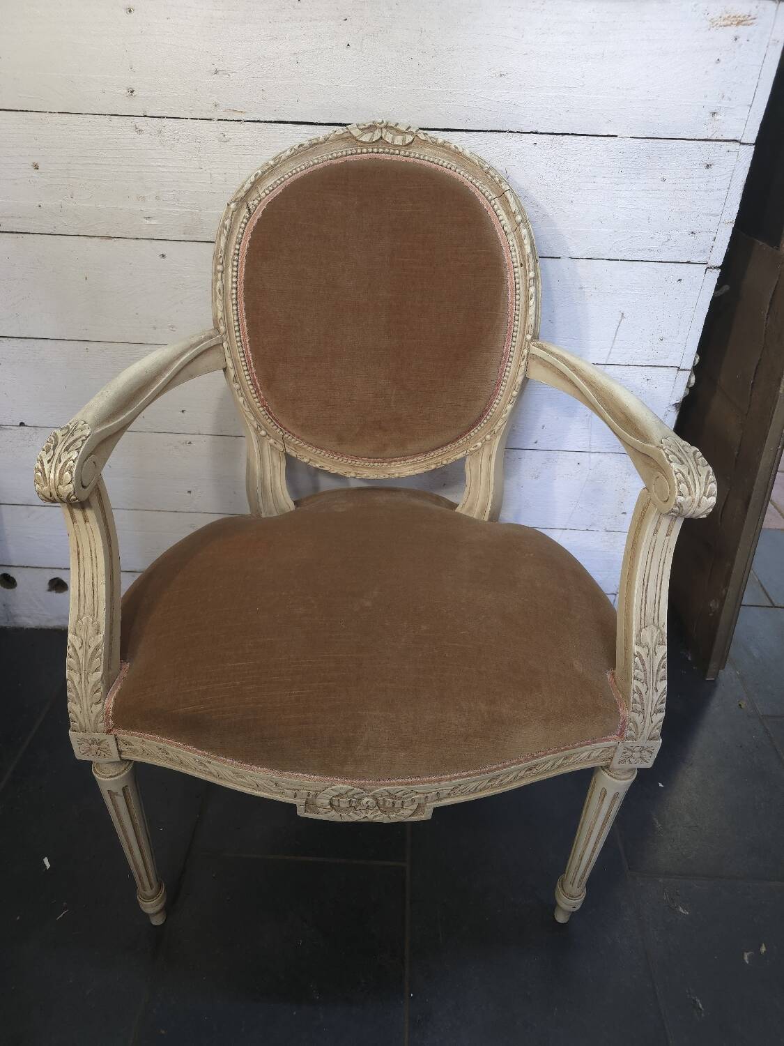 Louis XVI style bergère armchair in patinated wood