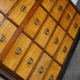 School cabinet bank of vintage Dutch drawers in mid-twentieth century pine