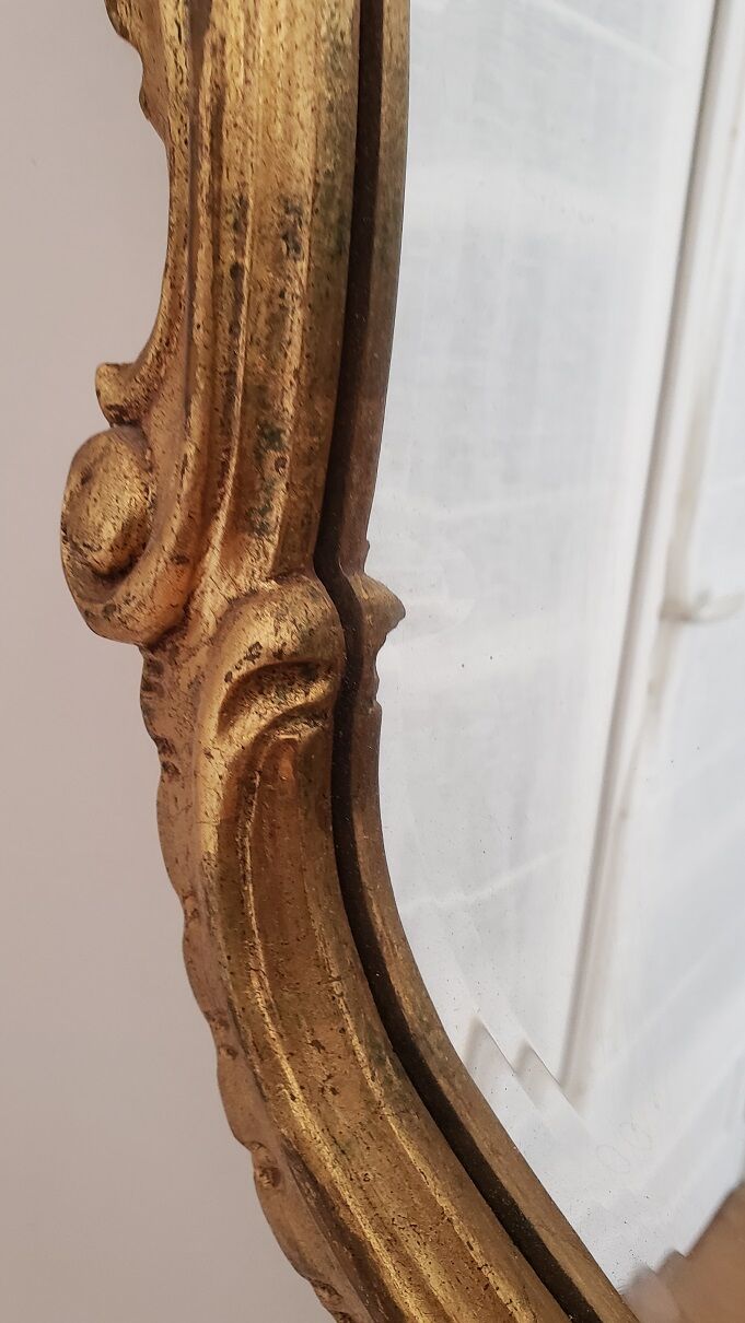 Beveled mirror and gilded wood