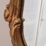 Beveled mirror and gilded wood