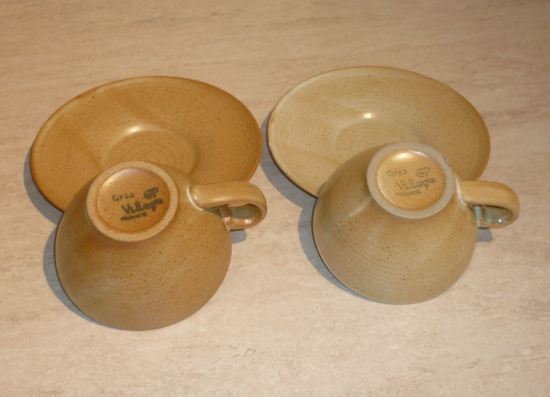 CNP Village stoneware cups and sub-cups