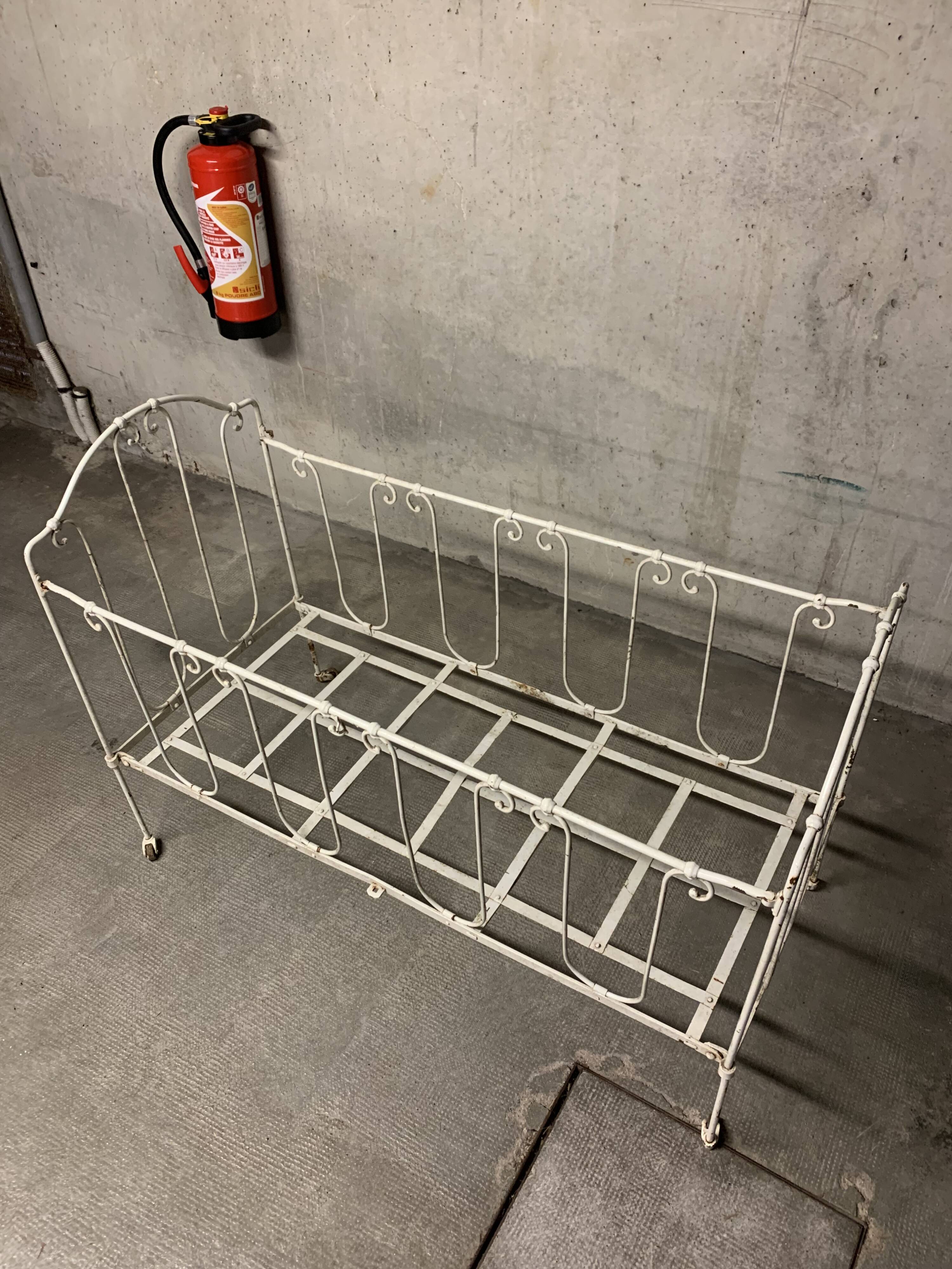 Old vintage wrought iron bench bed