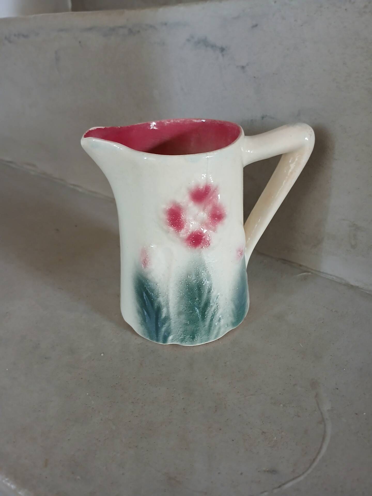 Small antique jug in slipware.
