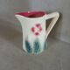 Small antique jug in slipware.