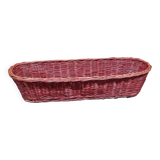 Old bread basket for baguette or red banneton in woven wicker
