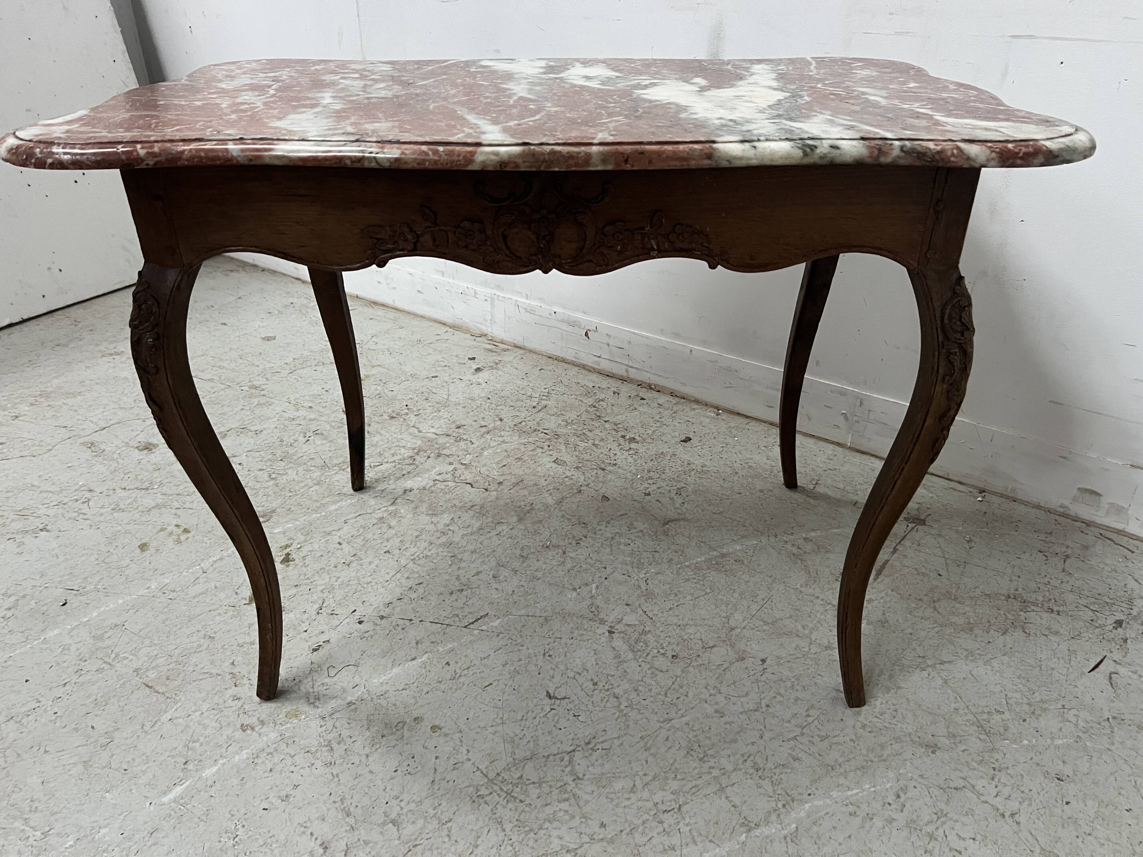Louis XV mid-table in oak and marble, 18th century.
