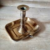 Antique metal and brass hand candle holder on rectangular base
