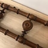 Wooden coat rack with swivel hooks