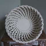 Cup on woven ceramic base with slip flowers