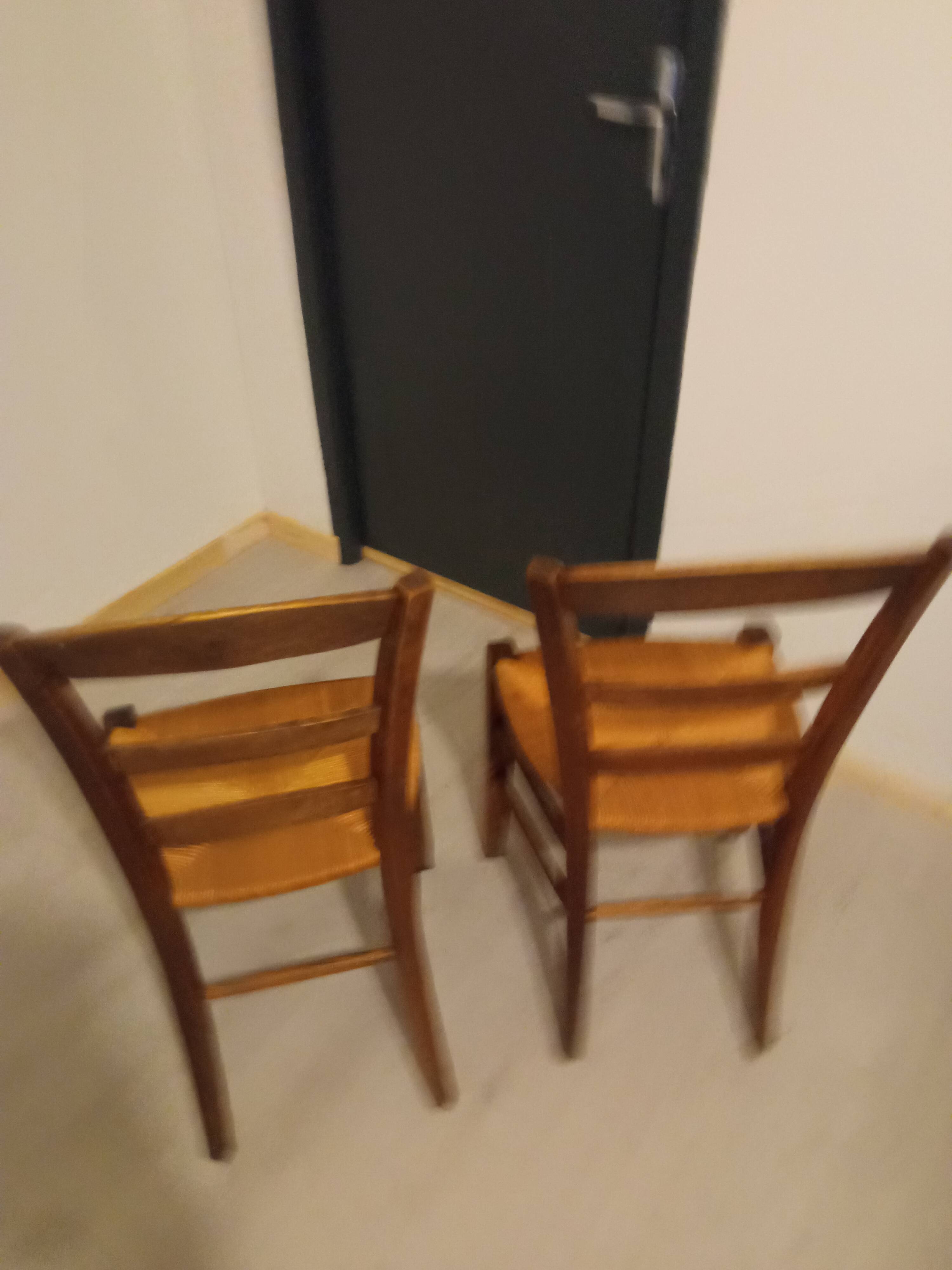 Pair of vintage wooden and woven straw chairs