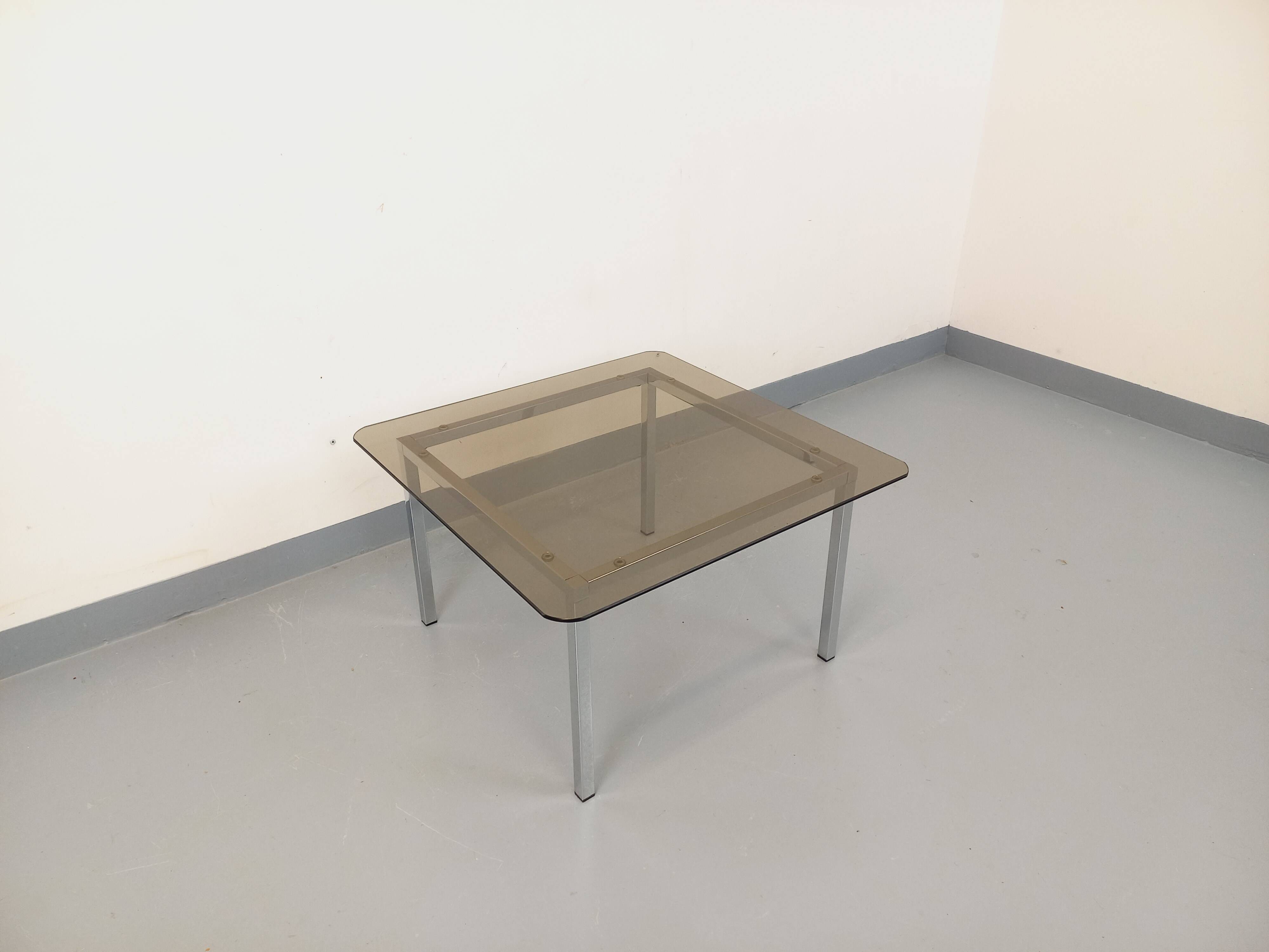 Vintage square coffee table in smoked glass and chrome metal from the 1970s.