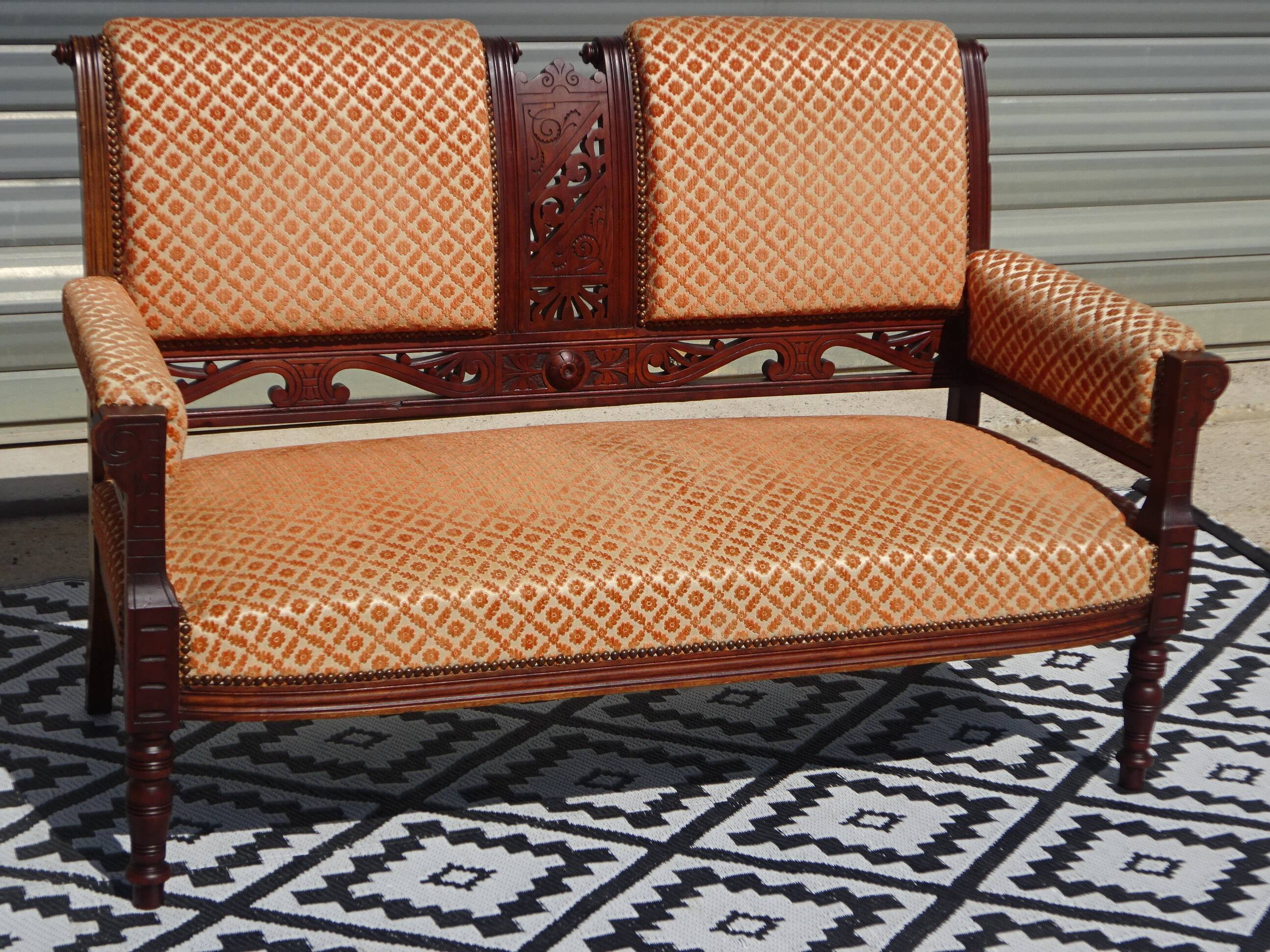 Vintage bench in wood and orange/ivory velvet.