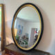 Miroir vintage ovale bois noir et doré