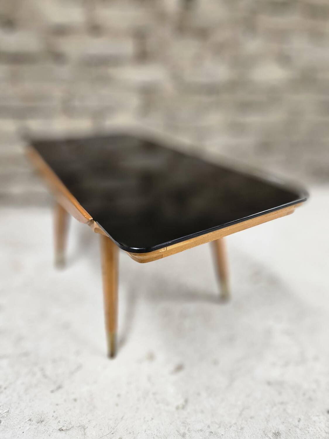 Small opaque black glass coffee table 1960