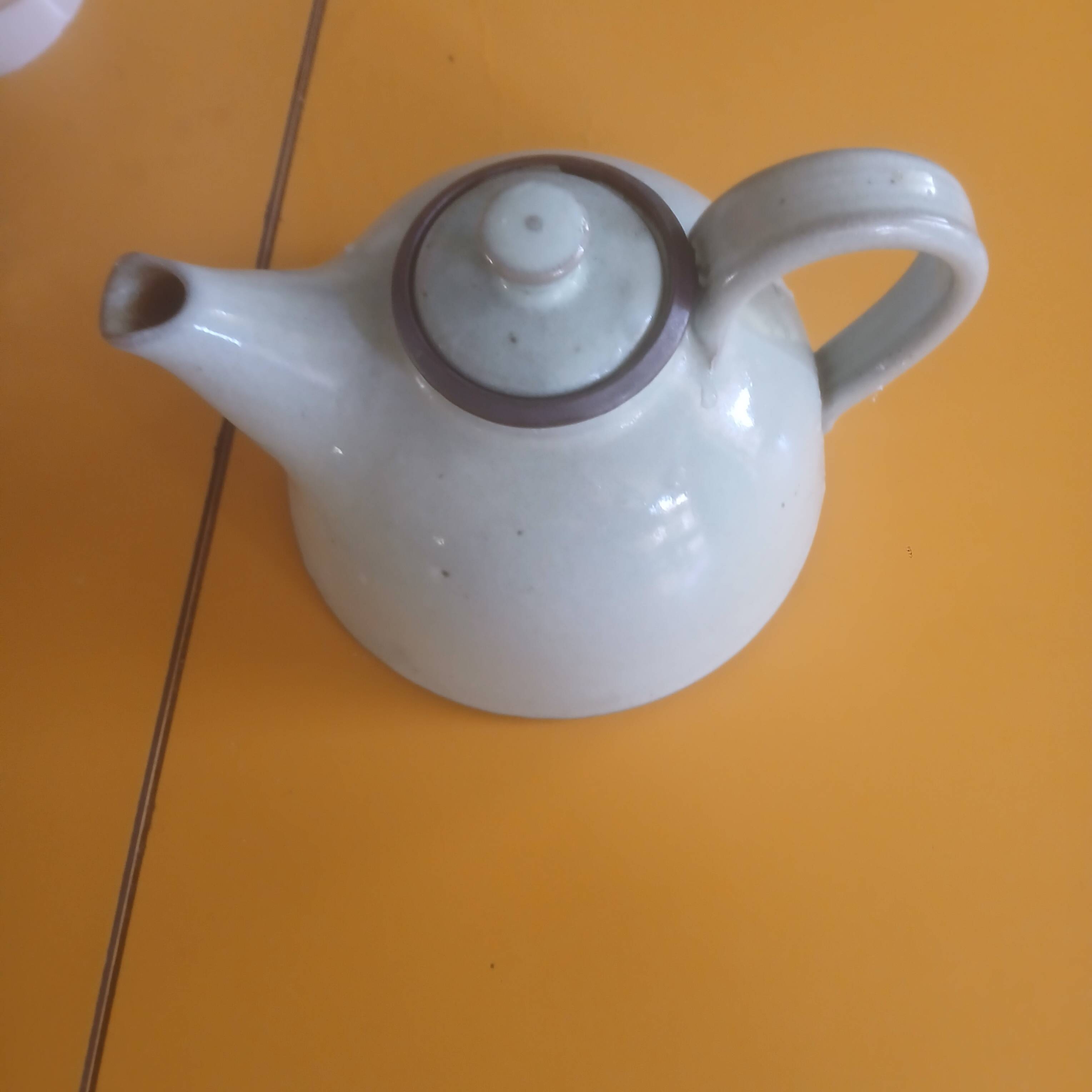 Vintage artisanal style glazed pottery teapot