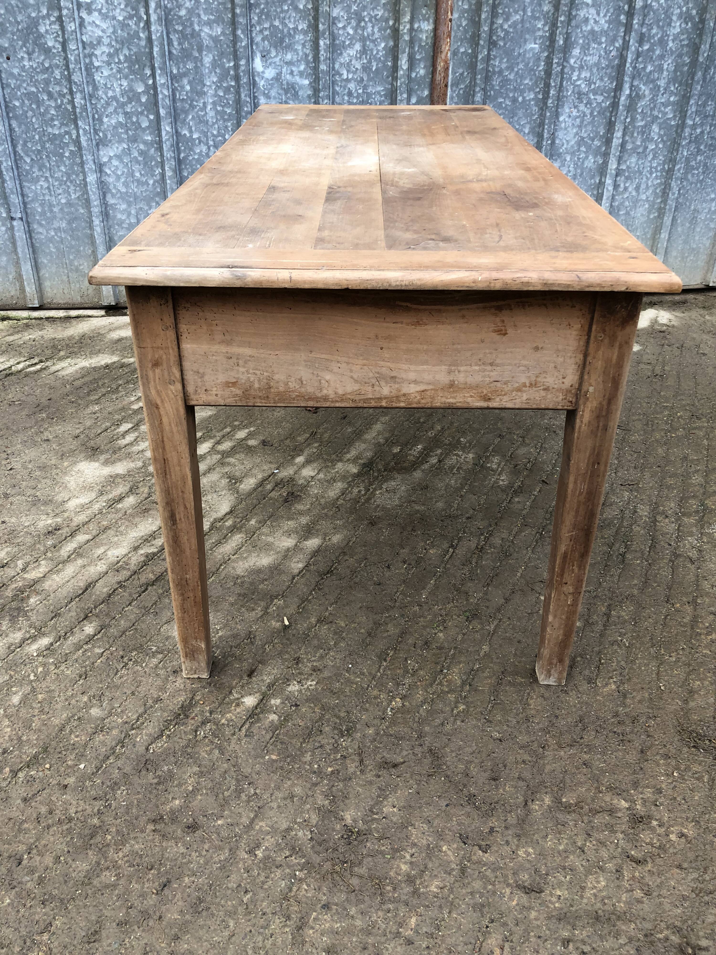 Antique solid cherry farm table with 3 front drawers.