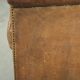 Vintage sheepskin club armchair finished with decorative nails