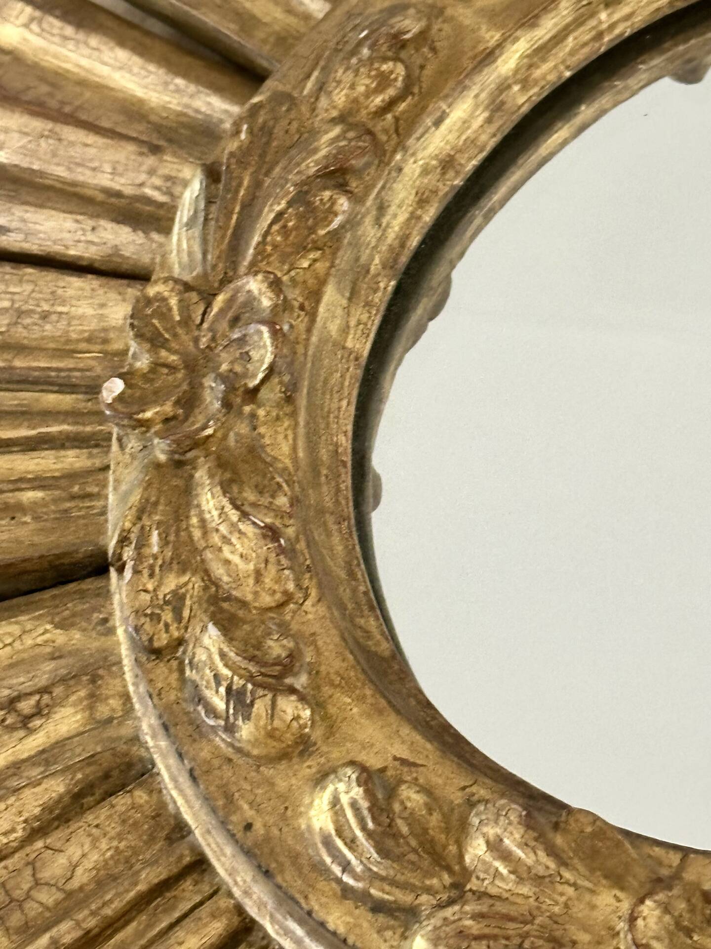 Large sun mirror in carved gilded wood.