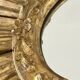 Large sun mirror in carved gilded wood.