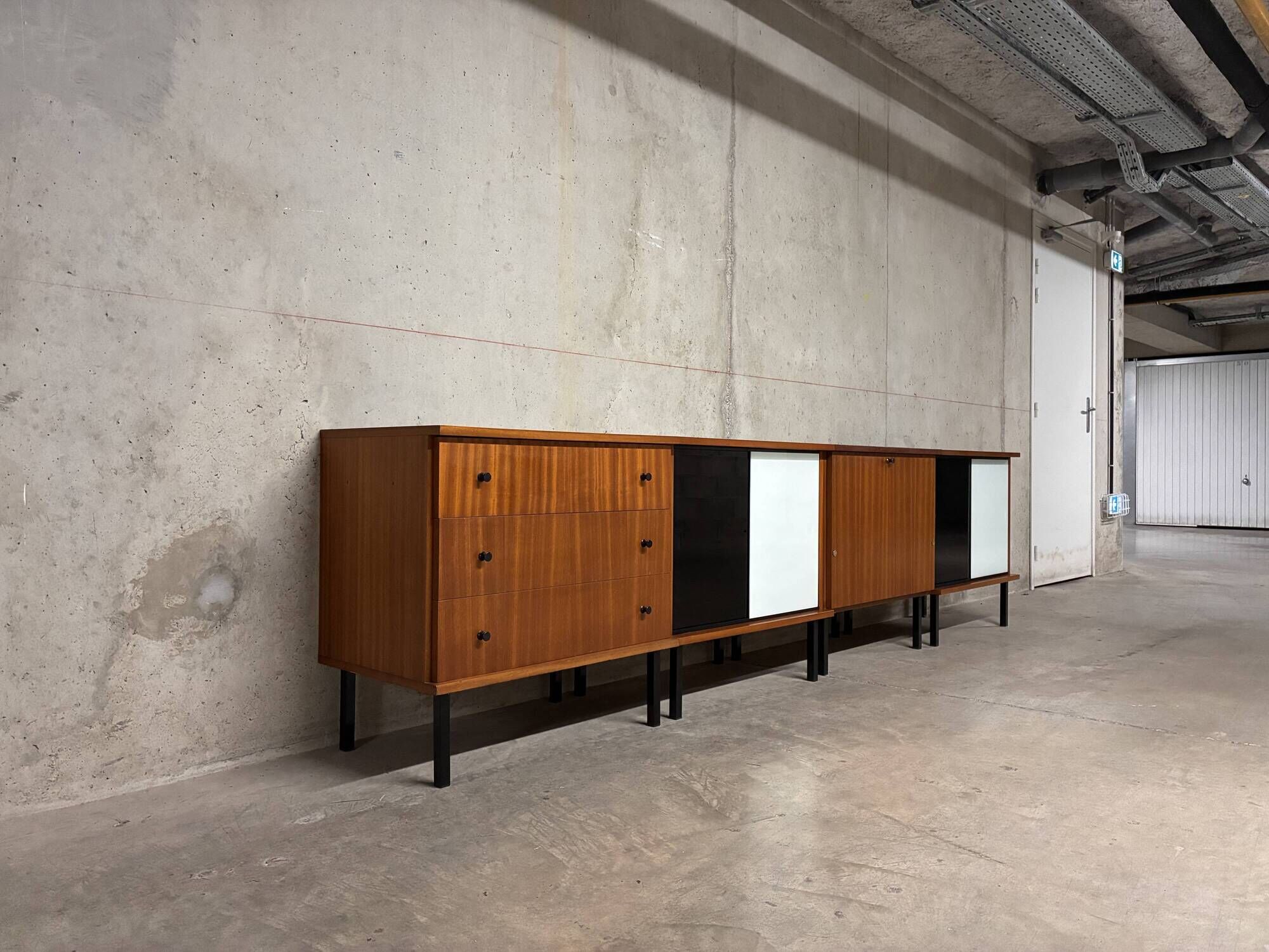 Enfilade buffet display cabinet in vintage 1950s style.